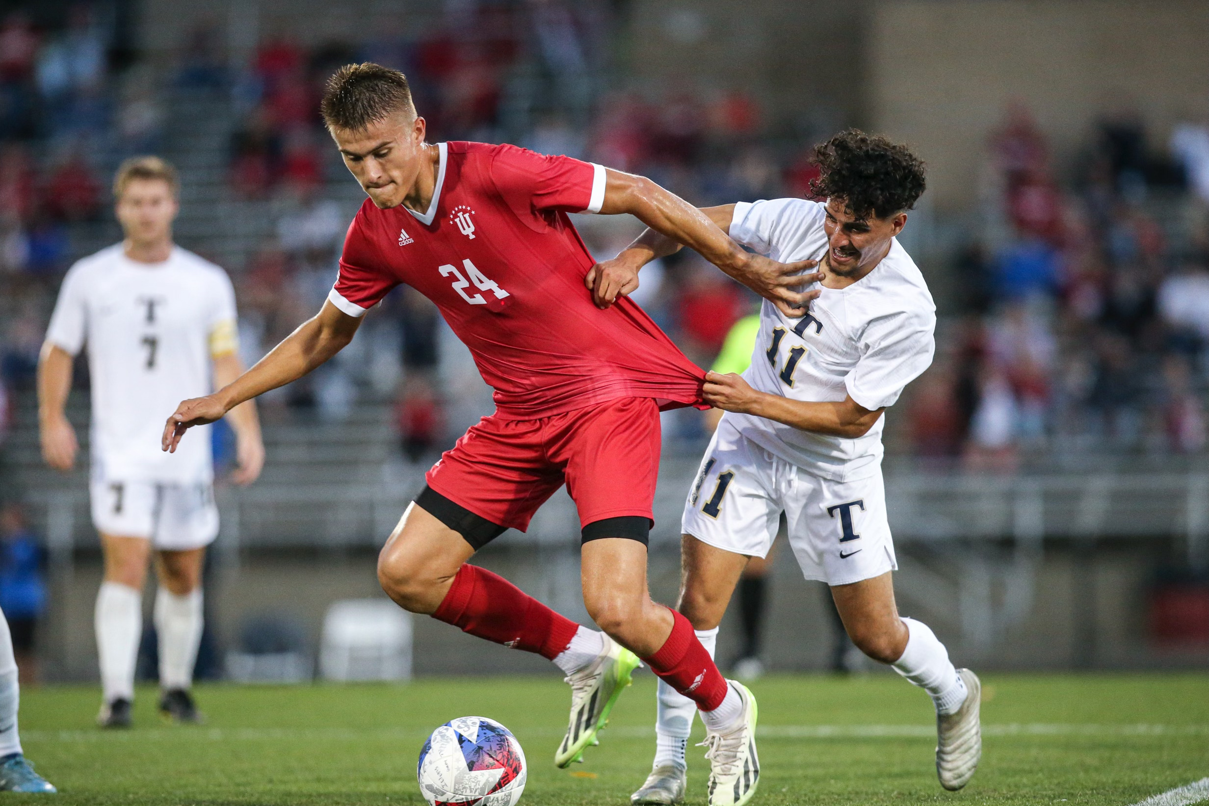 Oct. 27, 2023. Indiana redshirt senior Andrew Goldsworthy (24) dribbles with the ball against Trine. The Hoosiers won 2-0 at Bill Armstrong Stadium.