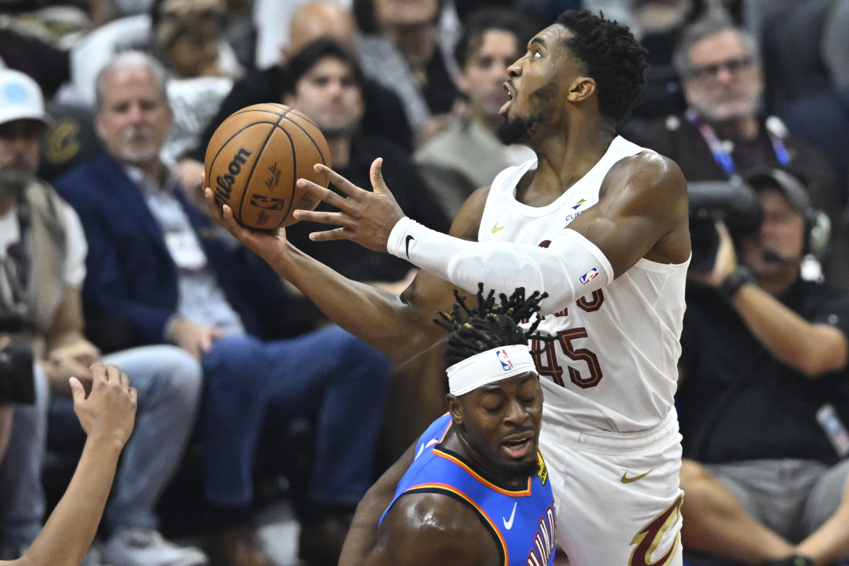 Oct 27, 2023; Cleveland, Ohio, USA; Cleveland Cavaliers guard Donovan Mitchell (45) moves against Oklahoma City Thunder guard Luguentz Dort (5) in the first quarter at Rocket Mortgage FieldHouse.