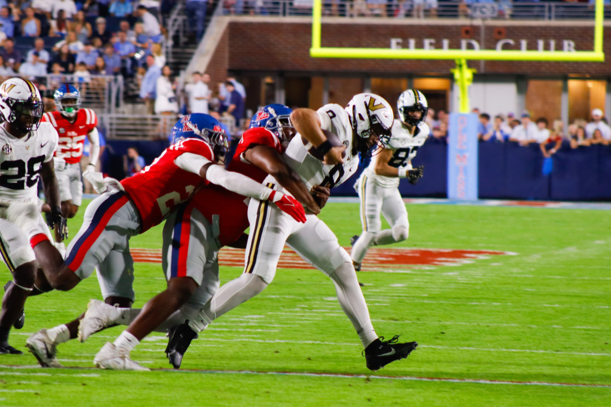 Ole Miss defenders bring down Vanderbilt Commodores quarterback Ken Seals in Week 9 (2023).