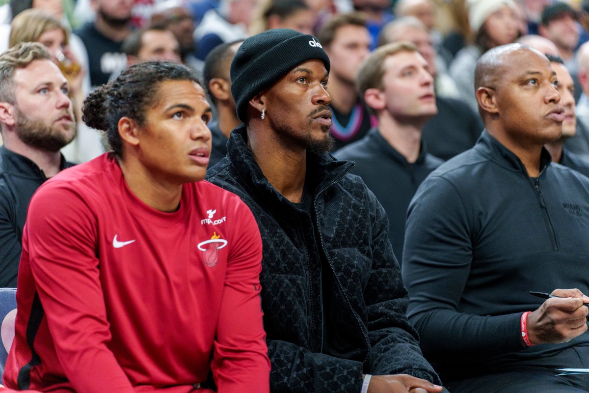 Oct 28, 2023; Minneapolis, Minnesota, USA; Miami Heat forward Jimmy Butler (22) watches play against the Minnesota Timberwolves in the first quarter at Target Center. 