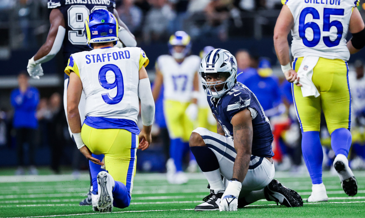 Dallas Cowboys linebacker Micah Parsons (11) reacts in front of Los Angeles Rams quarterback Matthew Stafford (9) during the first half at AT&T Stadium.