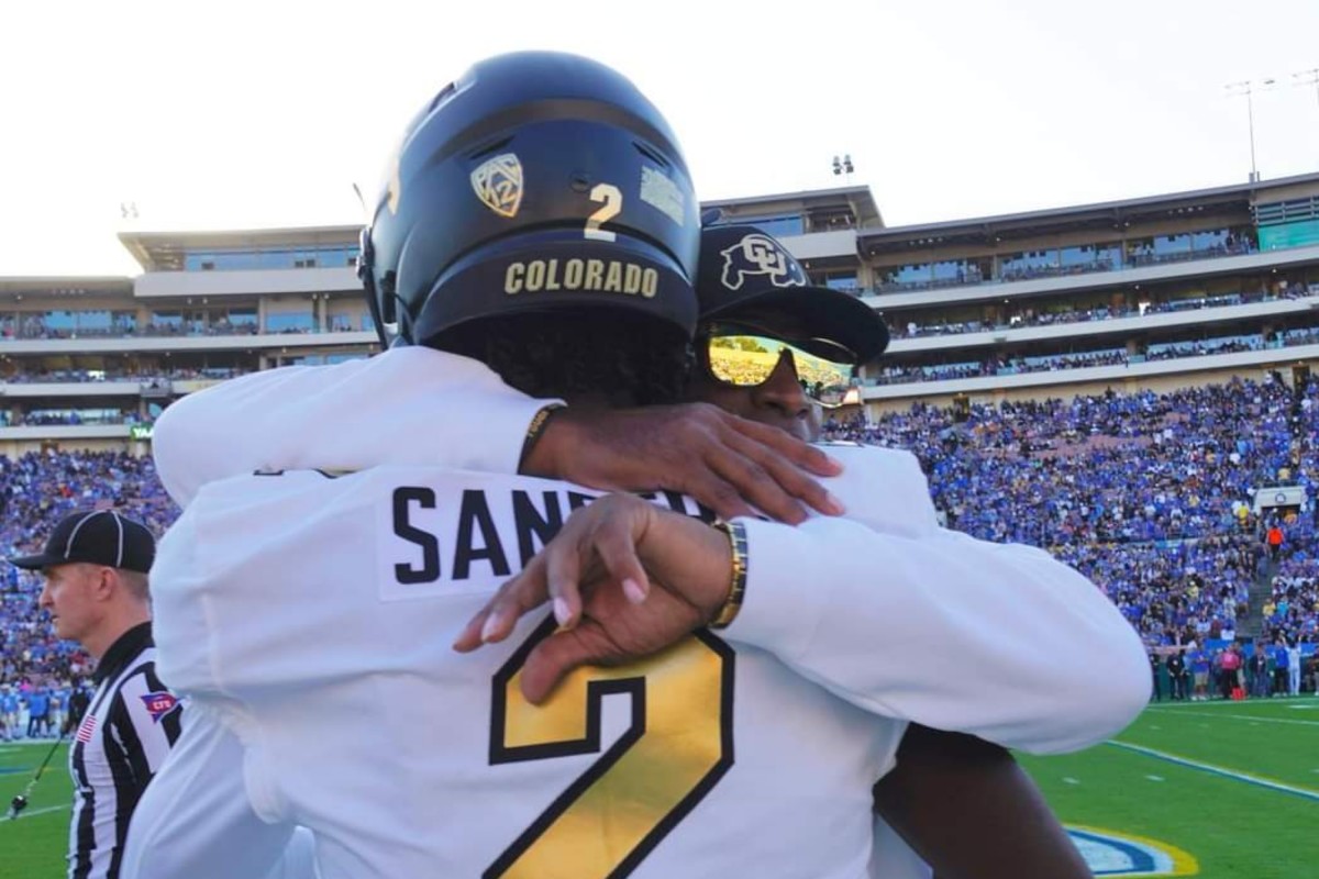 Deion Sanders hugging Shedeur Sanders at Rose Bowl on Oct. 28