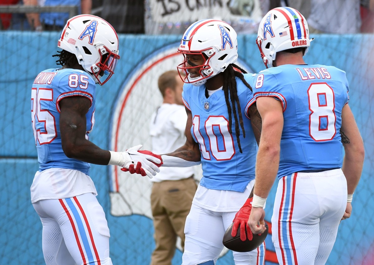 Tennessee Titans wide receiver DeAndre Hopkins (10) celebrates with tight end Chigoziem Okonkwo (85) and quarterback Will Levis (8) after a touchdown during the first half against the Atlanta Falcons at Nissan Stadium.