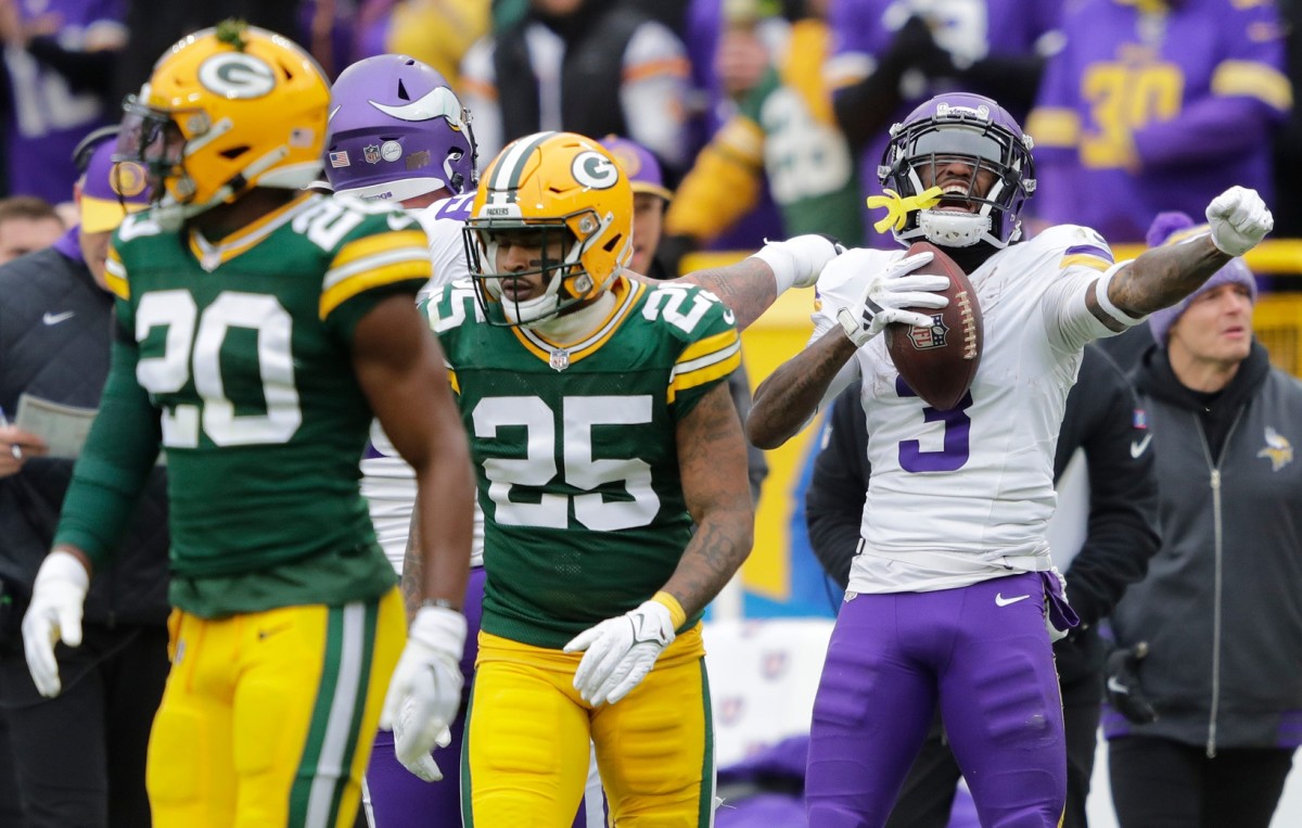 Minnesota Vikings wide receiver Jordan Addison (3) celebrates a first down reception against Green Bay Packers safety Rudy Ford (20) and cornerback Keisean Nixon (25) during their football game Sunday, October 29, 2023, at Lambeau Field in Green Bay, Wis.