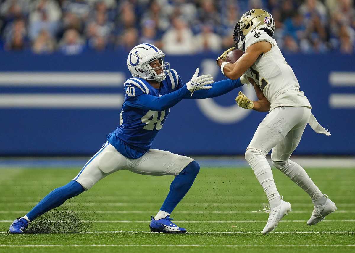 Indianapolis Colts cornerback Jaylon Jones (40) moves in on New Orleans Saints wide receiver Chris Olave (12) as he carries the ball Sunday, Oct. 29, 2023, at Lucas Oil Stadium in Indianapolis. The Colts lost to the Saints, 38-27.