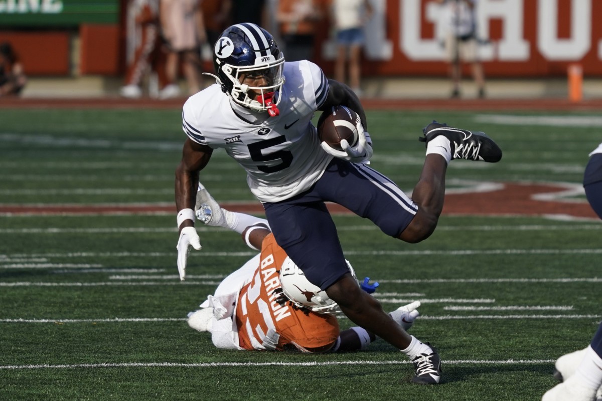 Oct 28, 2023; Austin, Texas, USA; Brigham Young Cougars wide receiver Darius Lassiter (5) runs for yardage after making a catch against the Texas Longhorns during the second half at Darrell K Royal-Texas Memorial Stadium.