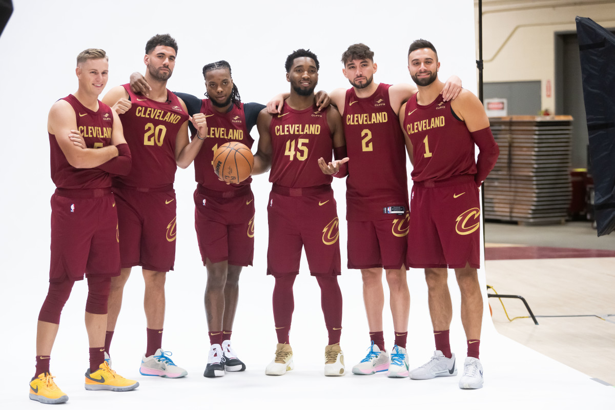 Sam Merrill (5) and forward Georges Niang (20) and guard Darius Garland (10) and guard Donovan Mitchell (45) and guard Ty Jerome (2) and guard Max Strus pose at media day