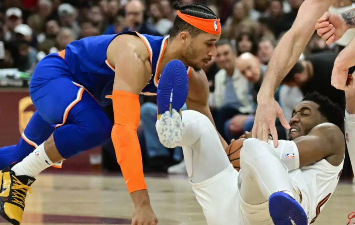 Hart (in blue) fights Mitchell for the ball during last year's playoffs