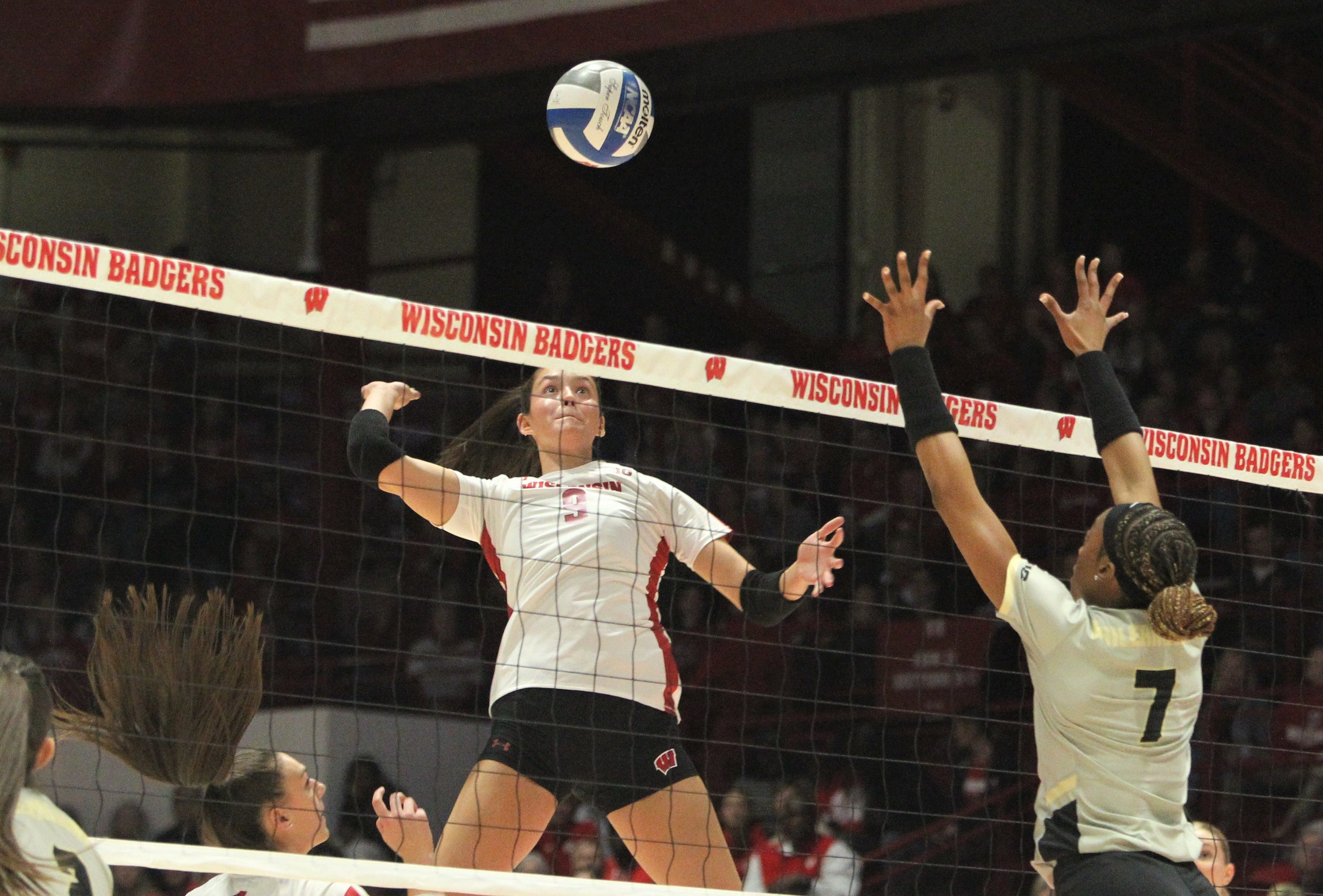 Wisconsin Caroline Crawford prepares to make a kill as Purdue's Raven Colvin defends on Wednesday Nov. 1, 2023 at the UW Field House in Madison, Wisconsin.