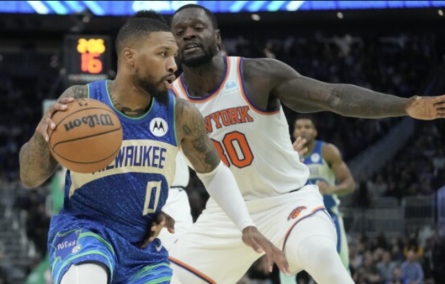 Damian Lillard (0) guarded by Julius Randle during Friday's In-Season Tournament action