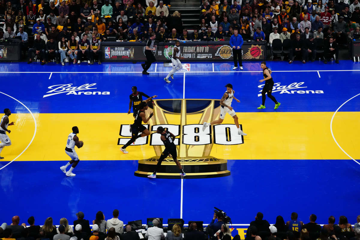 Fans taking in the Dallas Mavericks' game against the Denver Nuggets on Friday night had to adjust their eyes to Denver's colorful In-Season Tournament court.