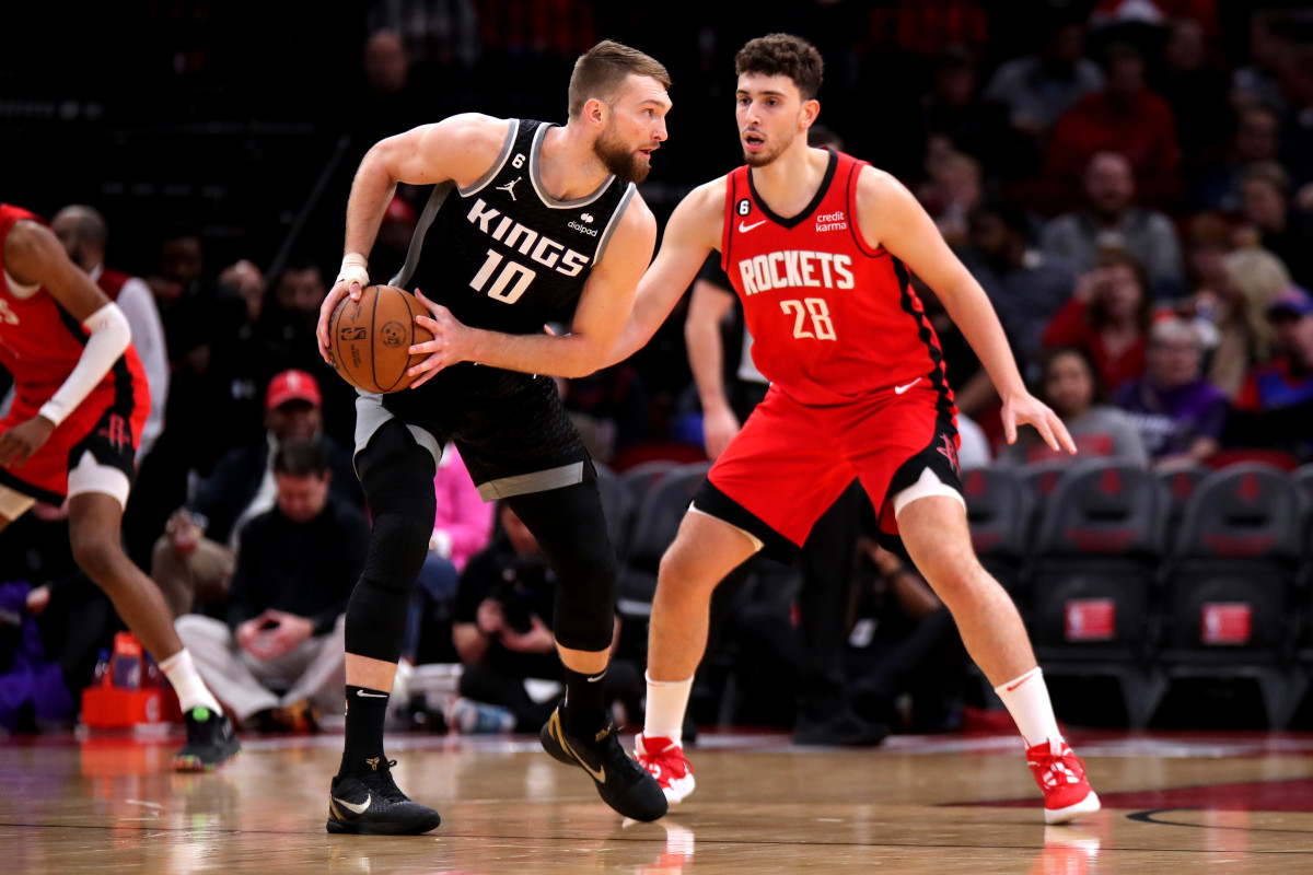 Kings forward Domantas Sabonis handles the ball against Houston Rockets center Alperen Sengun during the first quarter at Toyota Center.