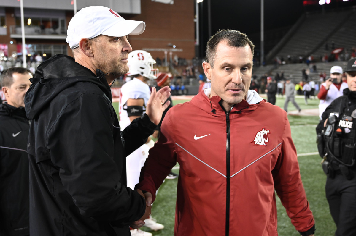 Nov 4, 2023; Pullman, Washington, USA; Stanford Cardinal head coach Troy Taylor, left, and Washington State Cougars head coach Jake Dickert meet after a game at Gesa Field at Martin Stadium. Stanford won 10-7. Mandatory Credit: James Snook-USA TODAY Sports