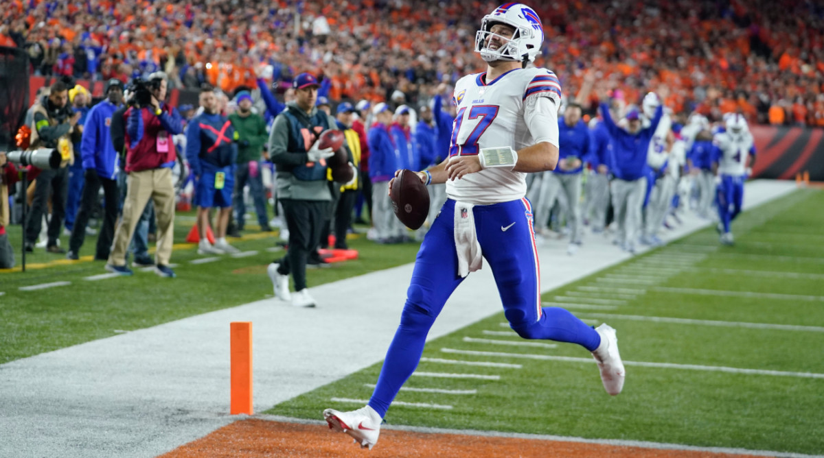 Buffalo Bills quarterback Josh Allen runs into the end zone for a touchdown against the Cincinnati Bengals during the first half.