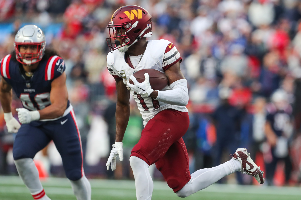 Washington Commanders receiver Terry McLaurin (17) runs the ball during the second half against the New England Patriots at Gillette Stadium.