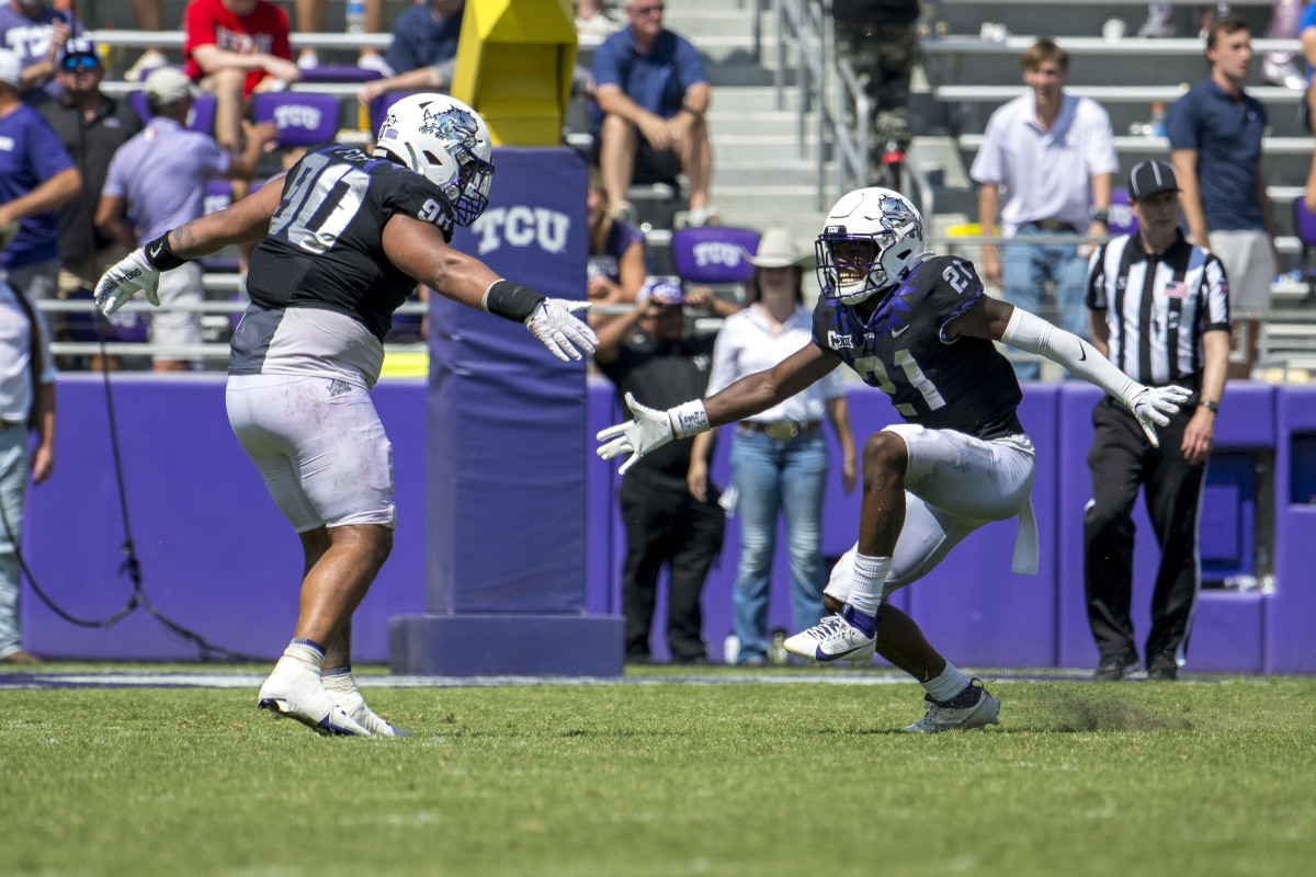 Sep 23, 2023; Fort Worth, Texas, USA; TCU Horned Frogs safety Bud Clark (21) and the Horned Frog defense celebrate after Clark intercepts an SMU Mustangs pass during the second half at Amon G. Carter Stadium.