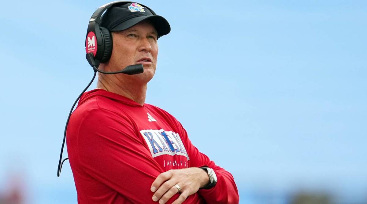 Kansas head coach Lance Leipold looks on while coaching in a game.