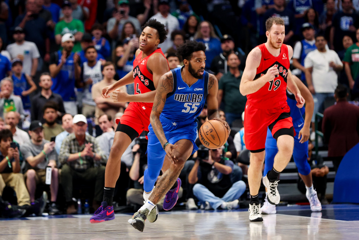 Mavs' Derrick Jones Jr. dribbles up the floor against the Toronto Raptors.