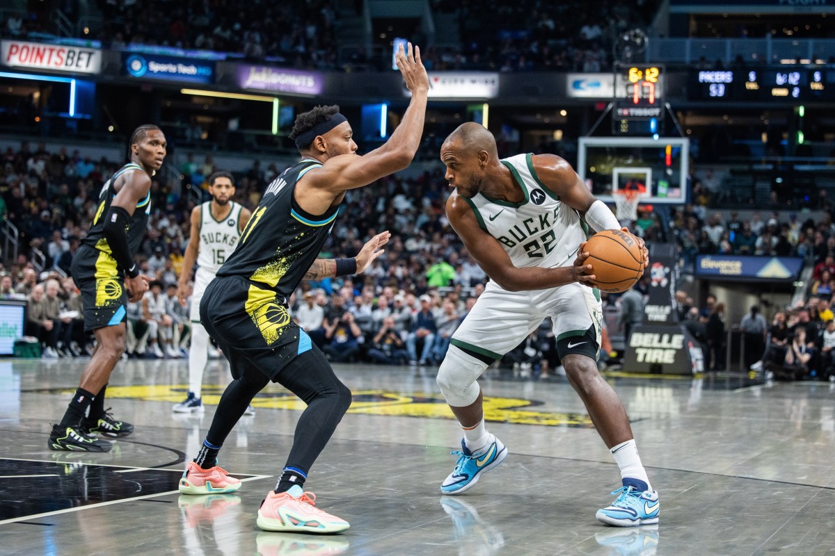 Milwaukee Bucks forward Khris Middleton (22) looks to dribble the ball while Indiana Pacers forward Bruce Brown (11) 