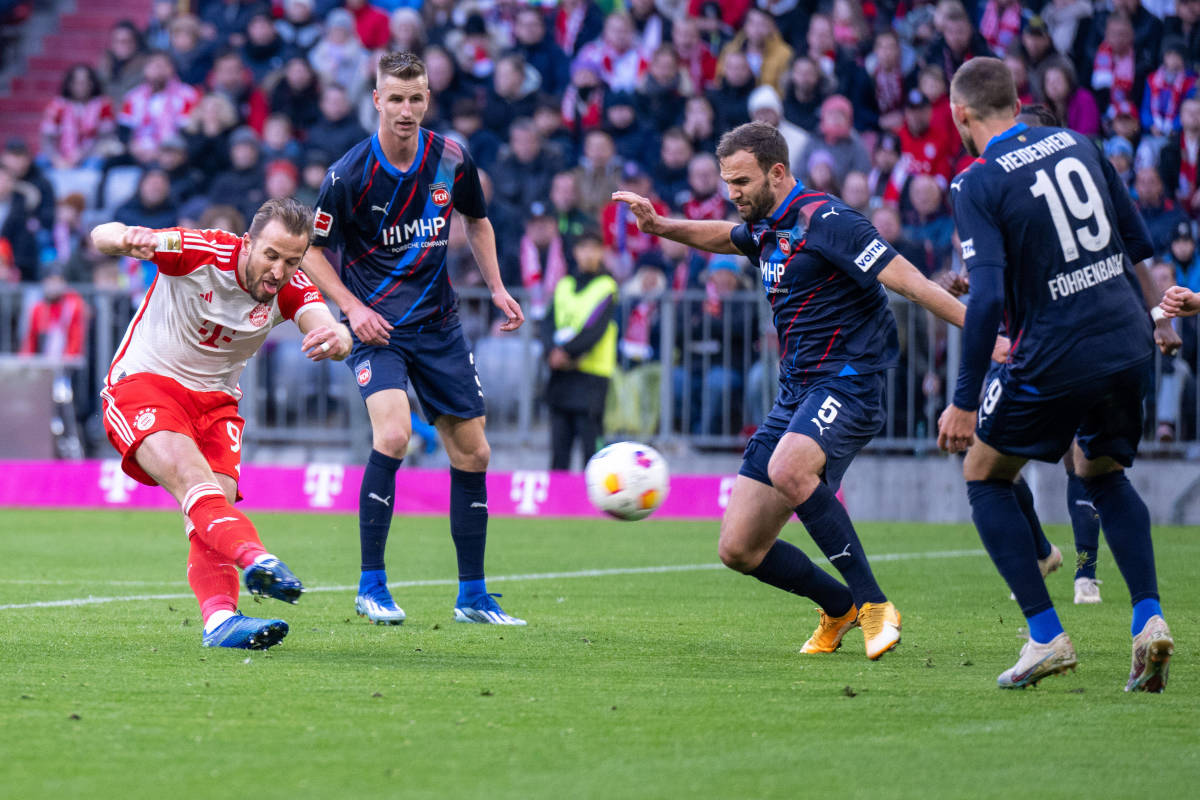 Harry Kane pictured (left) scoring the 20th goal of his Bayern Munich career during a Bundesliga game against FC Heidenheim in November 2023