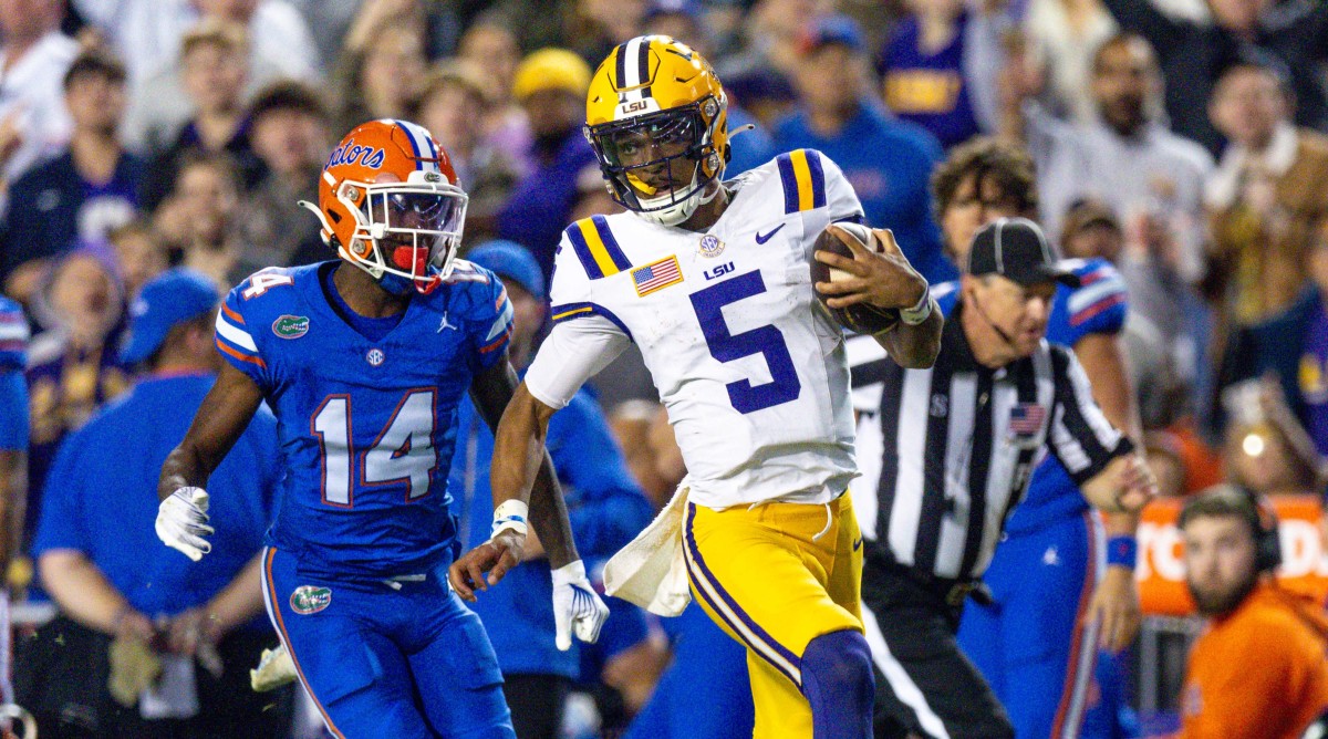 LSU quarterback Jayden Daniels runs for a touchdown during a game against Florida.