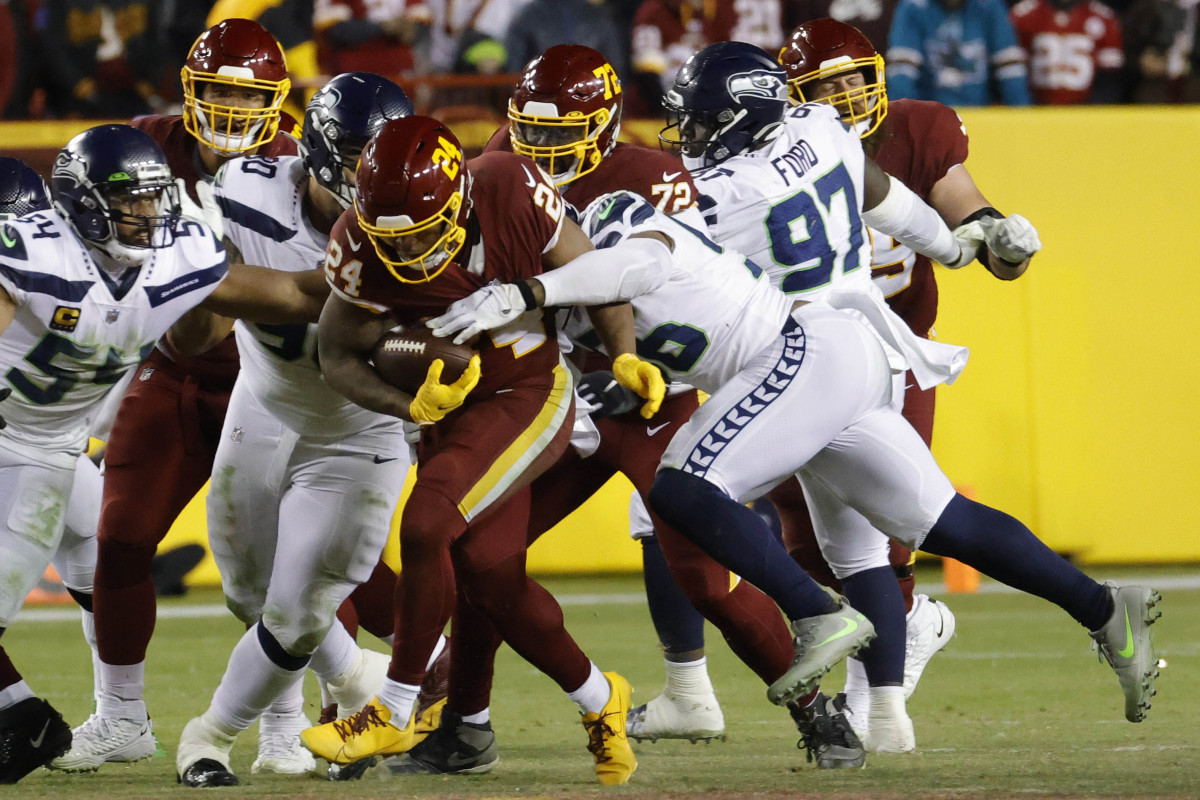 Washington Football Team running back Antonio Gibson (24) carries the ball against the Seattle Seahawks at FedExField.