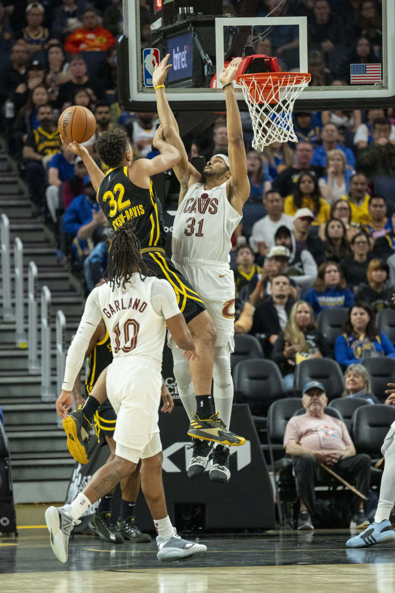 Nov 11, 2023; San Francisco, California, USA; Golden State Warriors forward Trayce Jackson-Davis (32) shoots a layup against Cleveland Cavaliers center Jarrett Allen (31) during the second quarter at Chase Center.