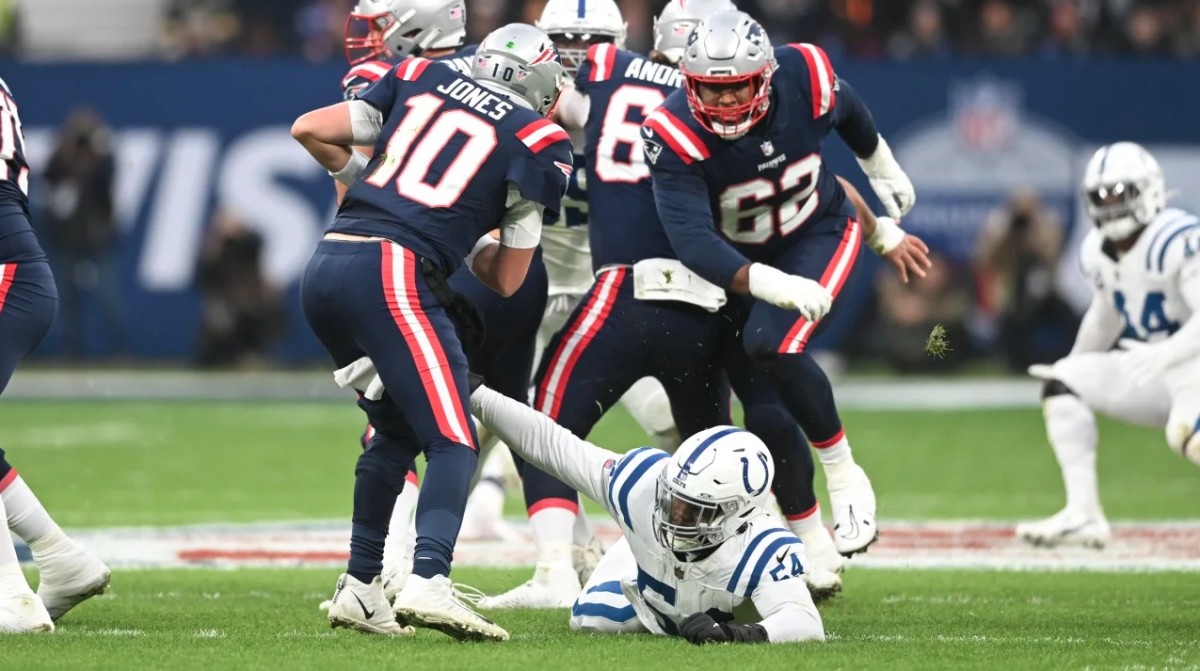 Indianapolis Colts defensive end Dayo Odeyingbo (54) reaches out to sack New England Patriots quarterback Mac Jones (10).