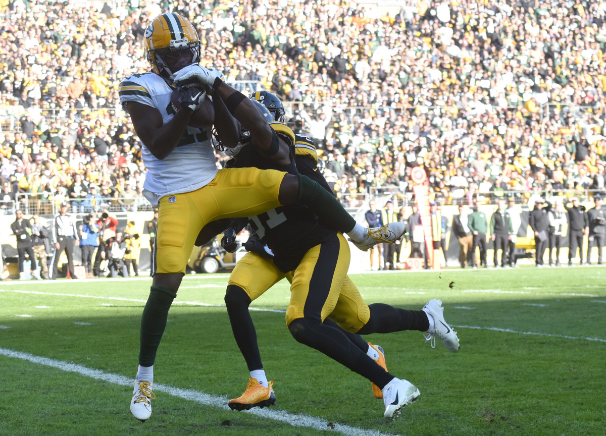 Packers rookie WR Jayden Reed catches a touchdown pass at Pittsburgh.