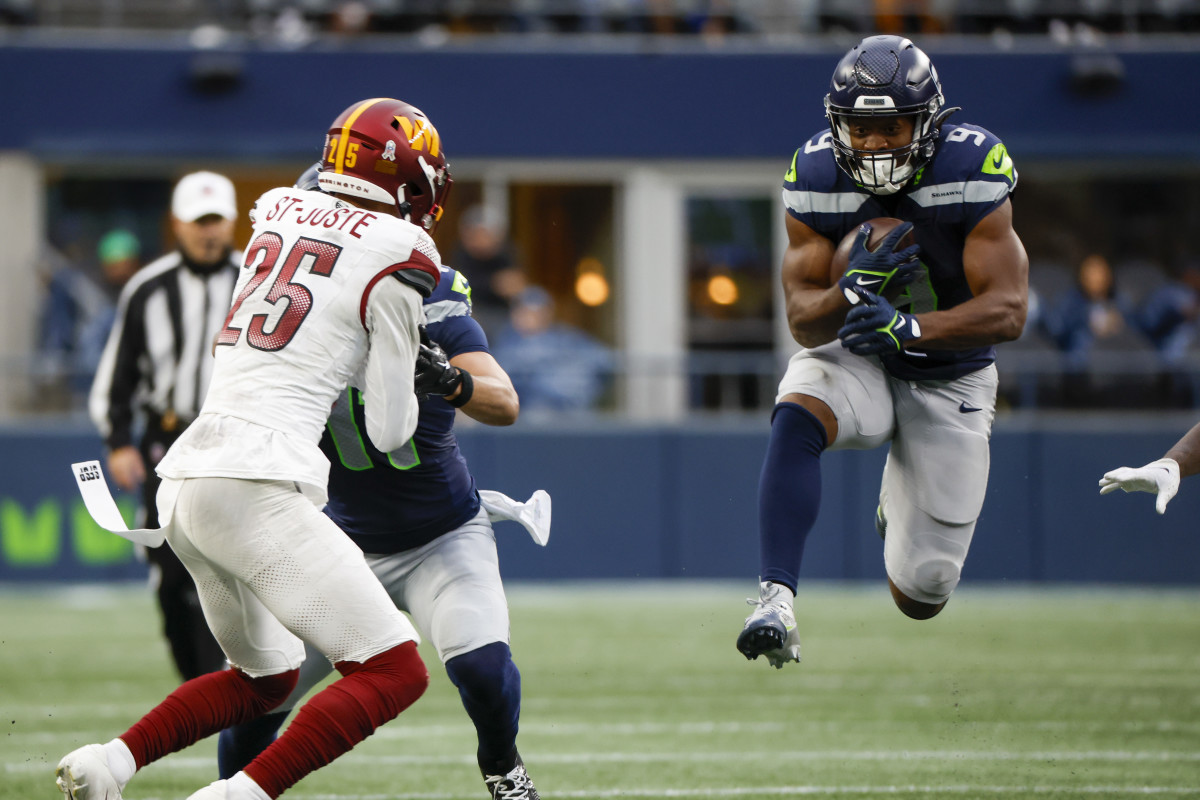 Seattle Seahawks running back Kenneth Walker III (9) rushes against the Washington Commanders during the second quarter at Lumen Field.