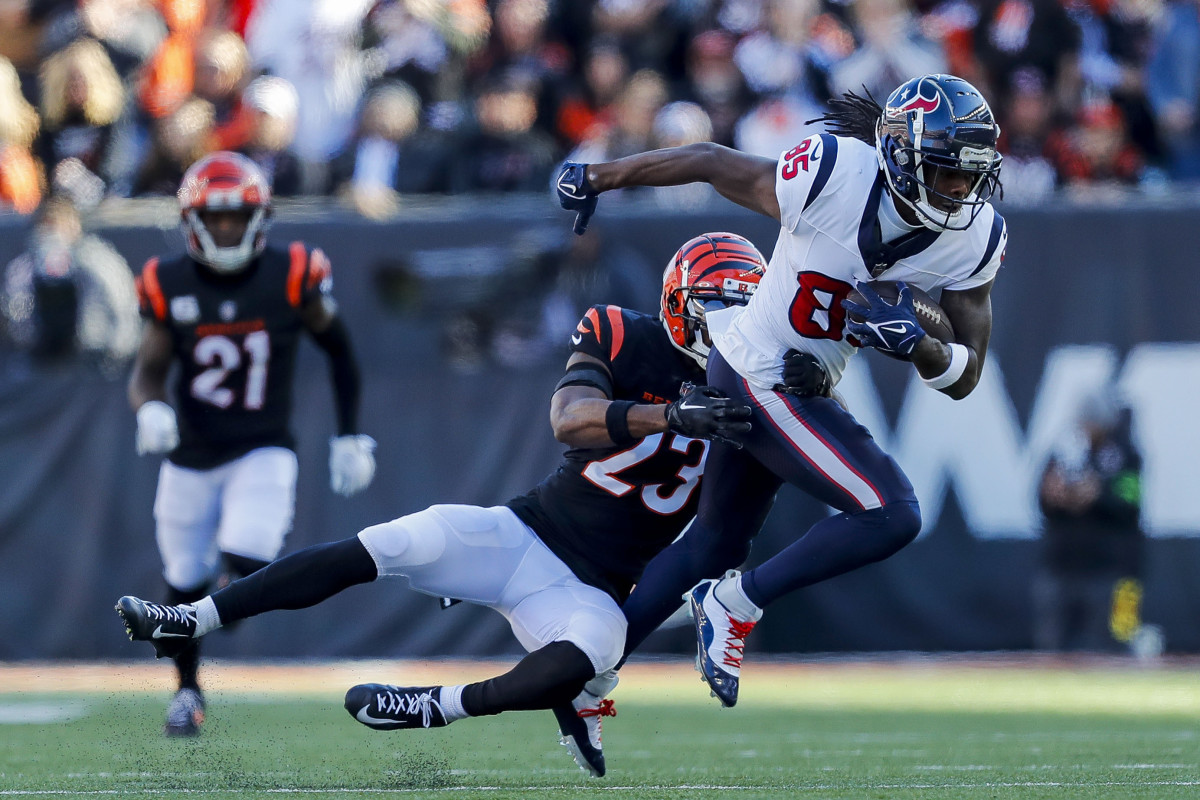 Texans wide receiver Noah Brown (85) runs with the ball against Cincinnati Bengals safety Dax Hill (23) in the first half at Paycor Stadium.