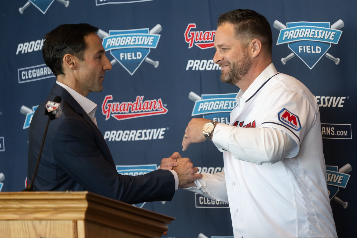 Nov 10, 2023; Cleveland, OH, USA; Cleveland Guardians president of baseball operations Chris Antonetti, left, shakes hands with new manager Stephen Vogt during an introductory press conference at Progressive Field.