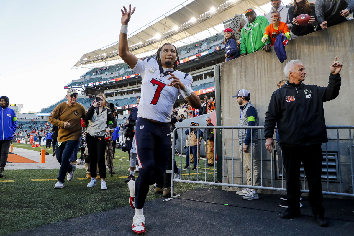 C.J. Stroud waves as he runs off the field