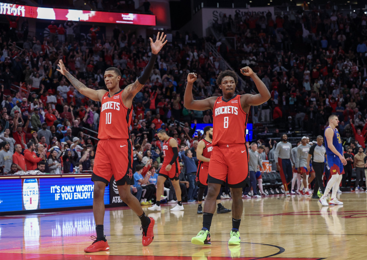 Houston Rockets forward Jabari Smith Jr. (10) and forward Jae'Sean Tate (8) celebrate the win against the Denver Nuggets at Toyota Center.