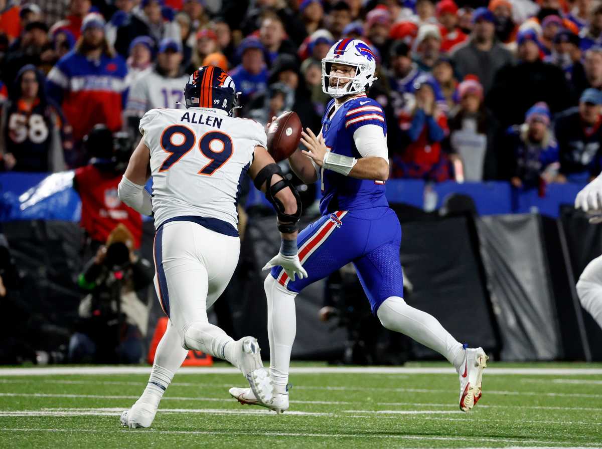 Buffalo Bills quarterback Josh Allen looks downfield as he is pressured by Denver Broncos defensive end Zach Allen. Allen threw for 177 yards and a touchdown. He also ran for a touchdown but the Bills lost to the Denver 24-22.