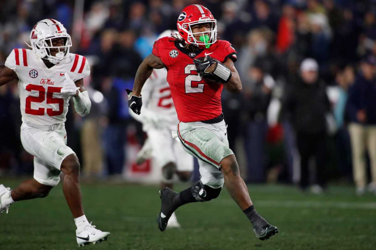 Georgia running back Kendall Milton (2) breaks away for a 51-yard gain during the second half of an NCAA college football game against Ole Miss in Athens, Ga., on Saturday, Nov. 11, 2023. Georgia won 52-17. ( Joshua L. Jones / USA TODAY NETWORK ).