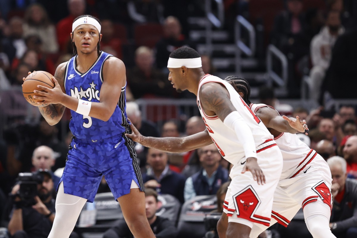 Orlando Magic forward Paolo Banchero (5) looks to pass the ball against Chicago Bulls forward Torrey Craig (13) during the first half at United Center.