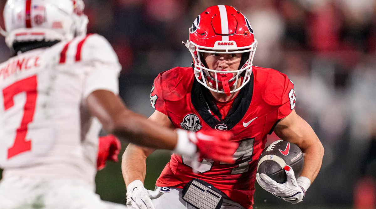 Georgia receiver Ladd McConkey carries the football after a catch during a game against Ole Miss.