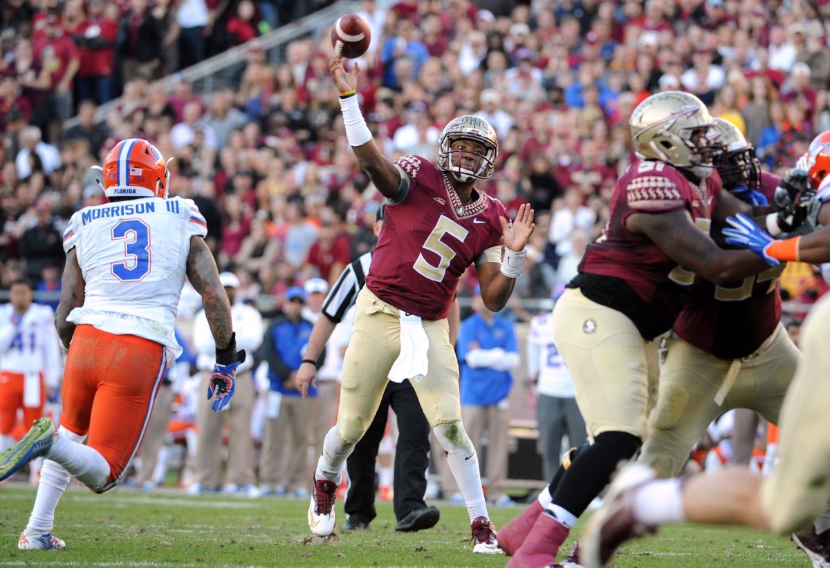 Nov 29, 2014; Florida State Seminoles quarterback Jameis Winston (5) throws a pass against the Florida Gators. Mandatory Credit: Melina Vastola-USA TODAY Sports