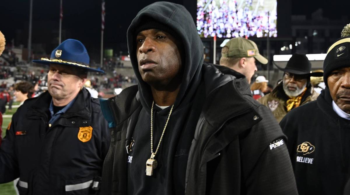 Colorado head coach Deion Sanders walks off the field following a loss against Washington State.