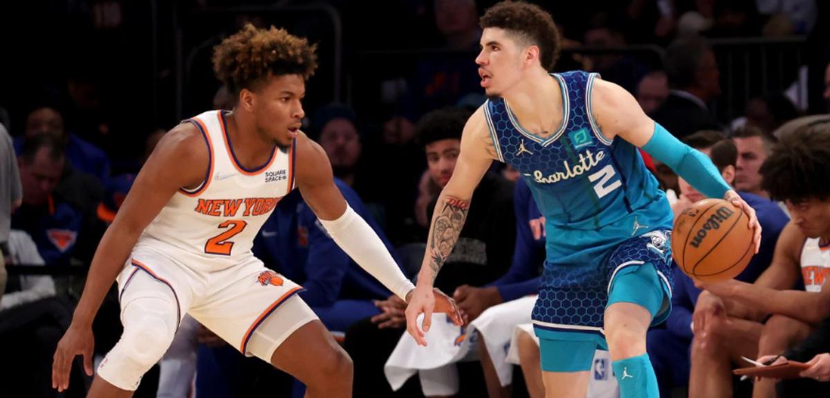 Miles McBride (L) guards LaMelo Ball during the 2021-22 season