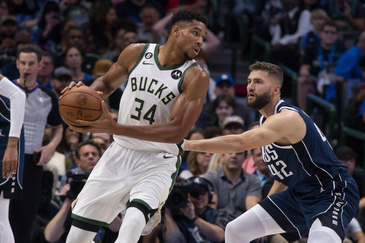 Mavs' Maxi Kleber defends Bucks' Giannis Antetokounmpo in the post.