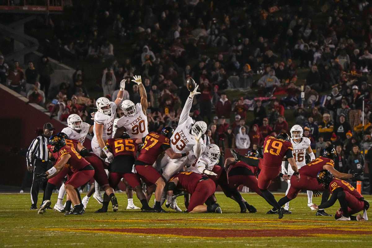 The Texas Longhorns attempt to block a kick by Iowa State kicker Chase Contreraz (19) during the game at Jack Trice Stadium on Saturday, Nov. 8, 2023 in Ames, Iowa. Contreraz missed the kick