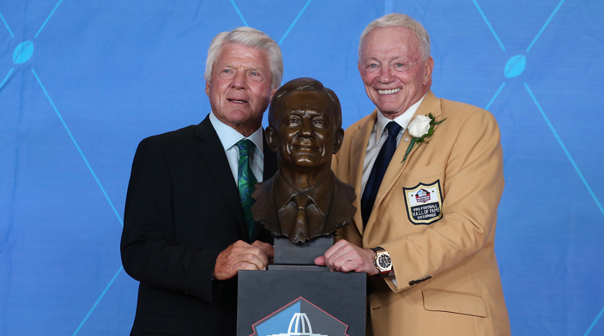 Cowboys owner Jerry Jones poses with former coach Jimmy Johnson (left) during the Professional Football HOF enshrinement ceremonies at the Tom Benson Hall of Fame Stadium.