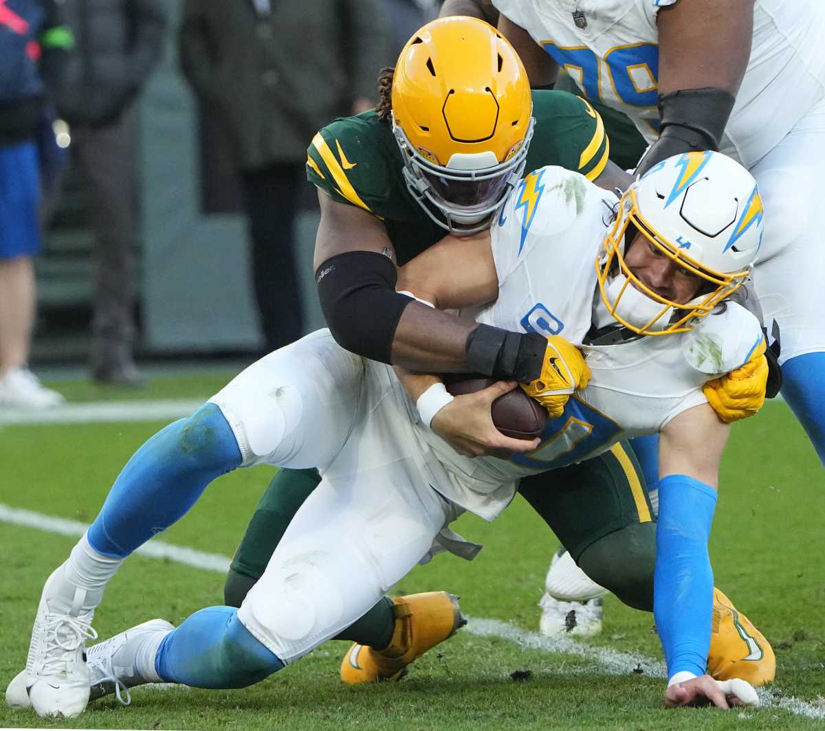 Green Bay Packers linebacker Rashan Gary (52) sacks Los Angeles Chargers quarterback Justin Herbert.