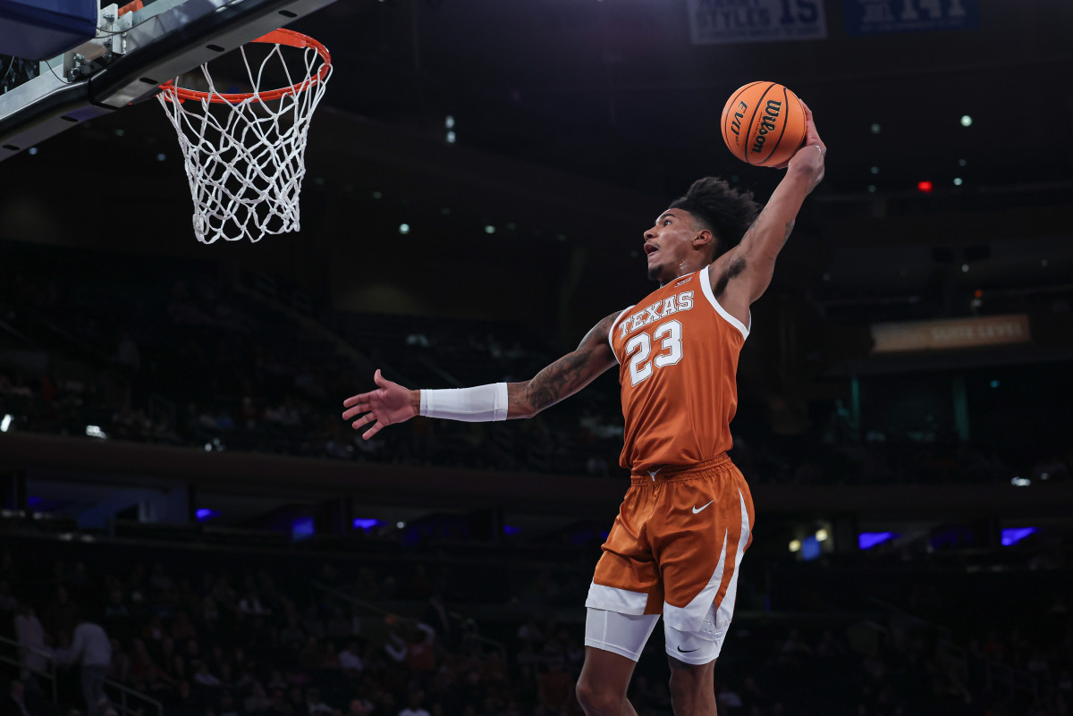 Texas Longhorns forward Dillon Mitchell (23) goes up for dunk during the first half against the Louisville Cardinals at Madison Square Garden.