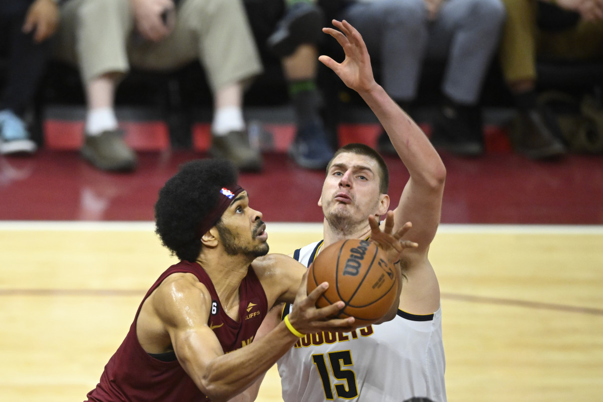 Feb 23, 2023; Cleveland, Ohio, USA; Cleveland Cavaliers center Jarrett Allen (31) drives beside Denver Nuggets center Nikola Jokic (15) in the fourth quarter at Rocket Mortgage FieldHouse.