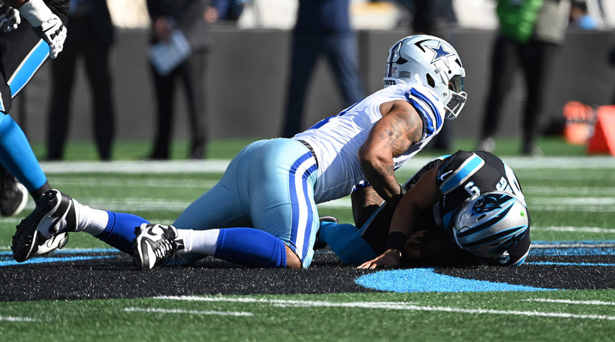 Cowboys linebacker Micah Parsons (11) sacks Panthers quarterback Bryce Young (9) in the first quarter at Bank of America Stadium.