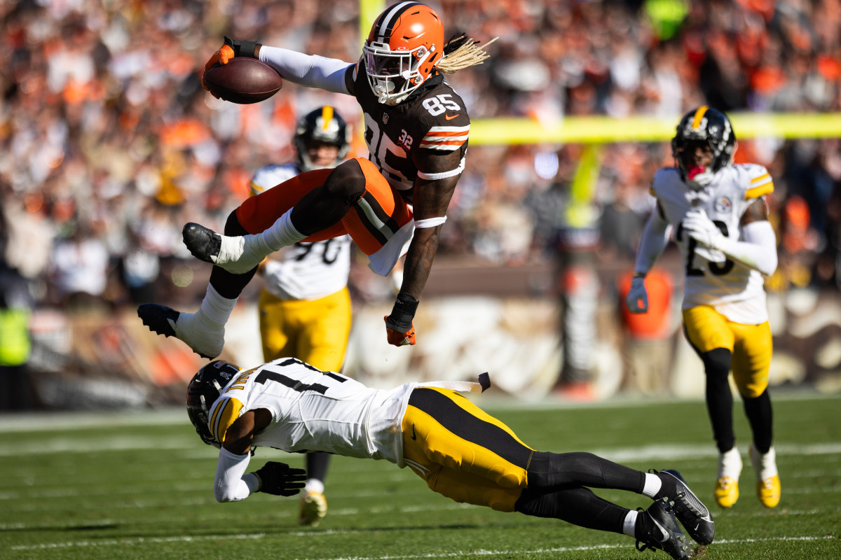Nov 19, 2023; Cleveland, Ohio, USA; Cleveland Browns tight end David Njoku (85) leaps over Pittsburgh Steelers safety Trenton Thompson (17) during the first quarter at Cleveland Browns Stadium.