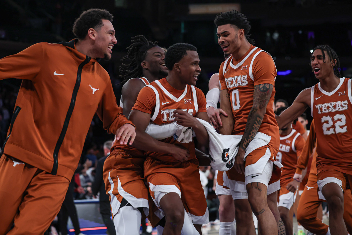 Texas Longhorns guard Max Abmas (3) celebrates with teammates after defeating the Louisville Cardinals at Madison Square Garden.